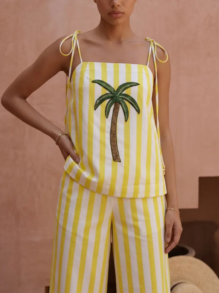 Maison Blu yellow stripe palm halter detail crop showing tied straps and sequin palm motif at chest