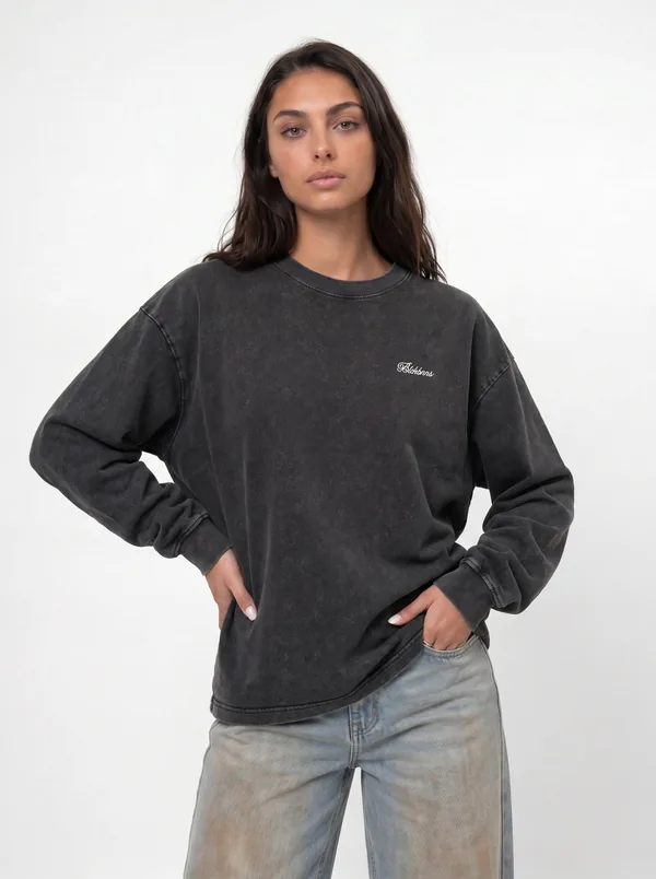MODA AI unified catalog shot — charcoal washed long-sleeve tee with jeans, unified storefront styling