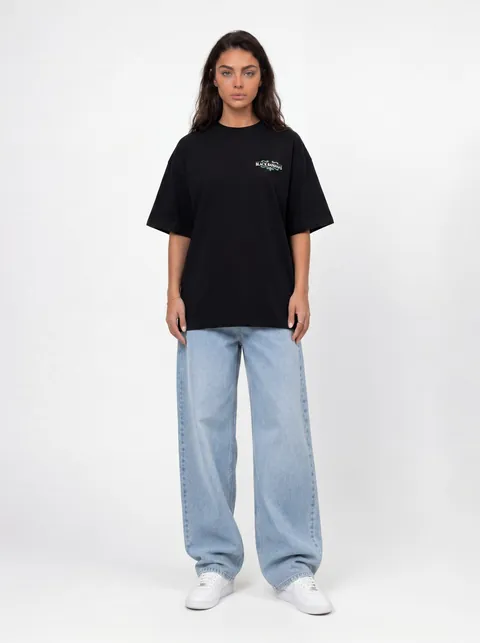 AI-generated full-length front-view model shot — black oversized tee styled with light wide-leg jeans