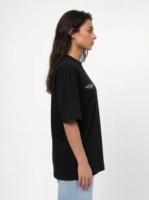 AI-generated side-profile model shot of the black oversized tee