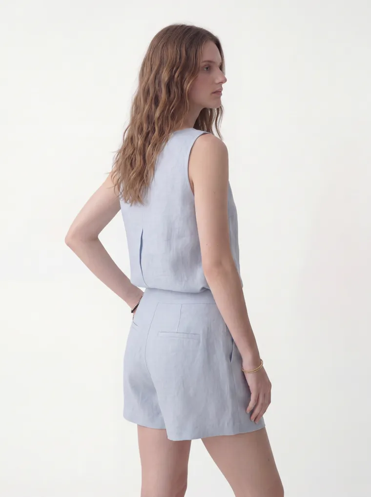 MODA AI catalog output — the linen set in powder blue, seated