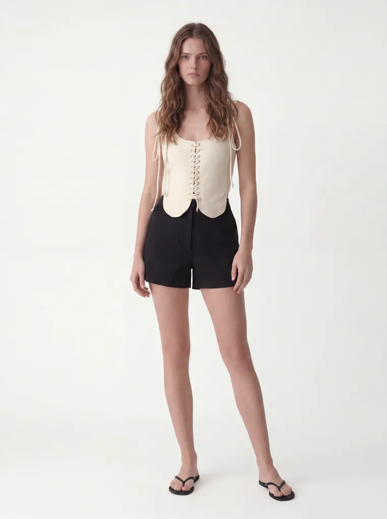 MODA AI catalog output — cream vest top, straight-on front, full length