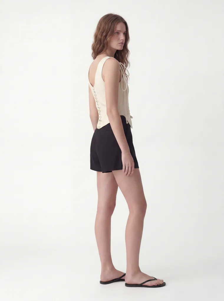 MODA AI catalog output — cream vest top, side profile