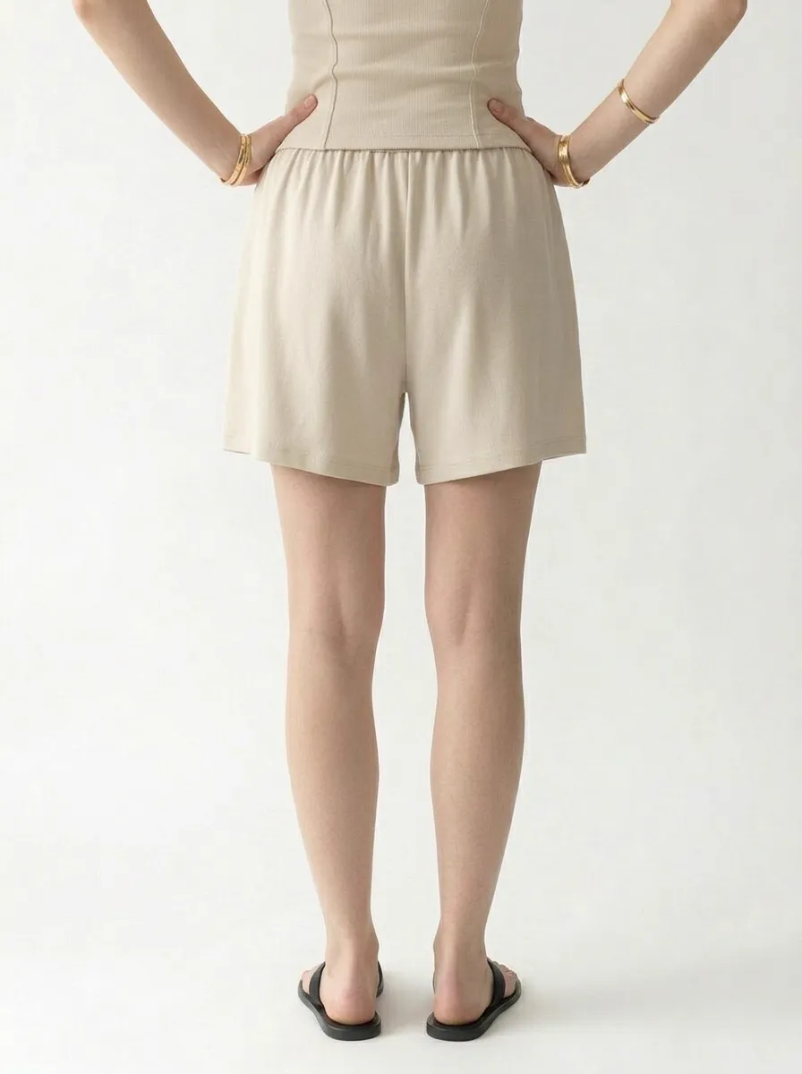 AI-generated model wearing Cream comfortwear — pose 4