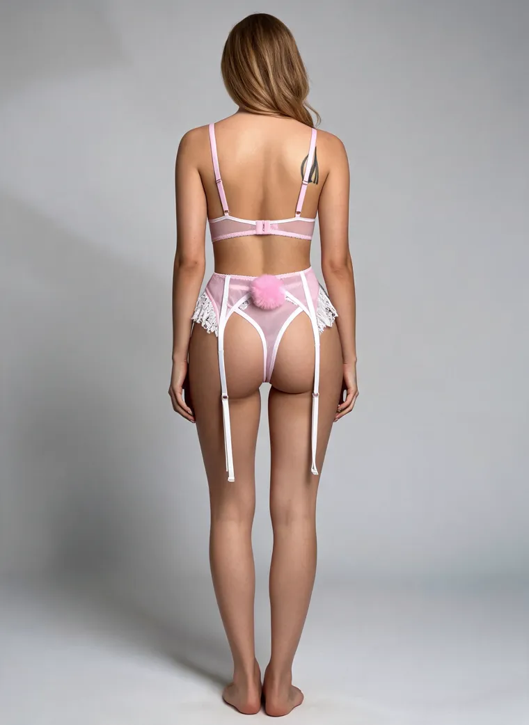 A white lace and pink bunny roleplay set with a pink bow collar, lace underwire bra, ruffled garter belt with suspenders and a pink pom-pom tail, on a grey studio ground. Bunny Roleplay Set in white and pink, frame 4 of 5