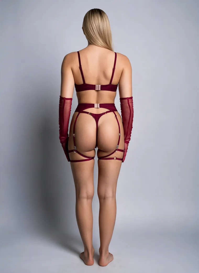 A burgundy satin gift-wrap harness set tied with a large front bow, with a matching choker, sheer opera gloves and thigh garters, on a grey studio ground. Gift-Wrap Harness Set in burgundy, frame 5 of 5