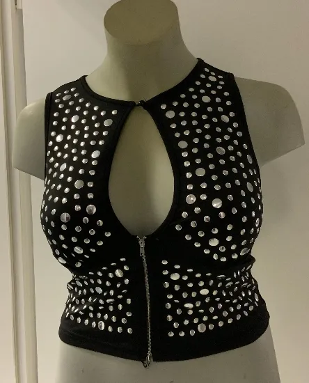 The seller’s phone photo of the black studded keyhole crop top on a shop mannequin, front view