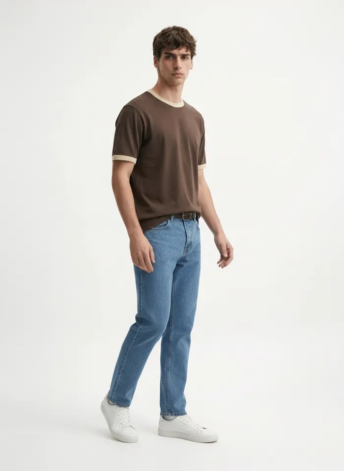 MODA AI on-model output — the brown tee and belted jeans, three-quarter, tee tucked in
