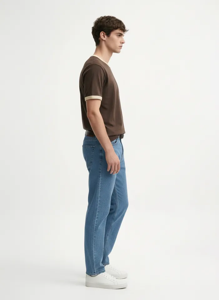 MODA AI on-model output — the brown ringer tee and belted jeans, lifestyle angle