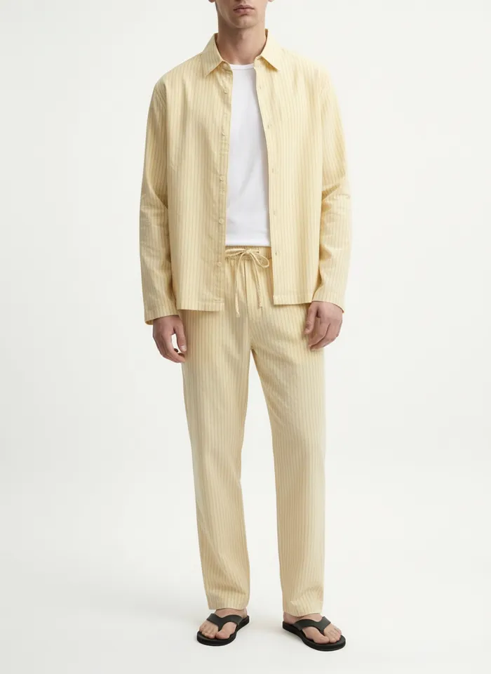 MODA AI on-model output — the yellow menswear set, back view