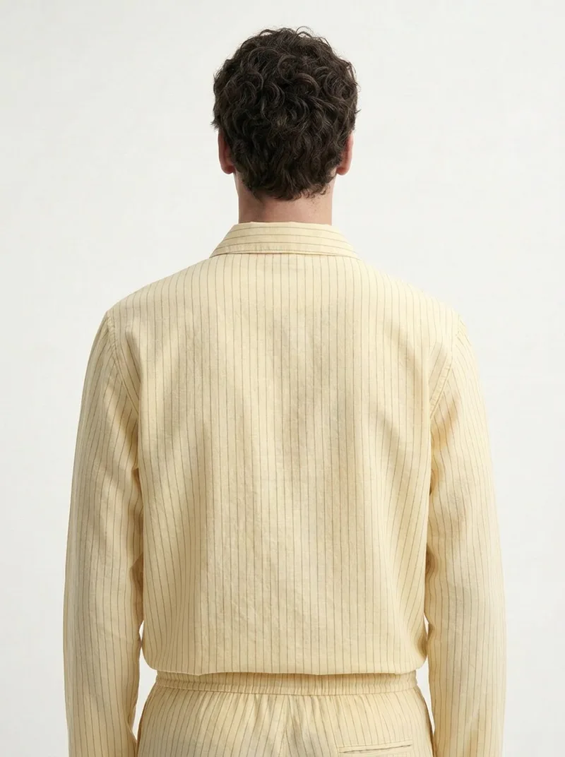 MODA AI output — model in the yellow set, three-quarter