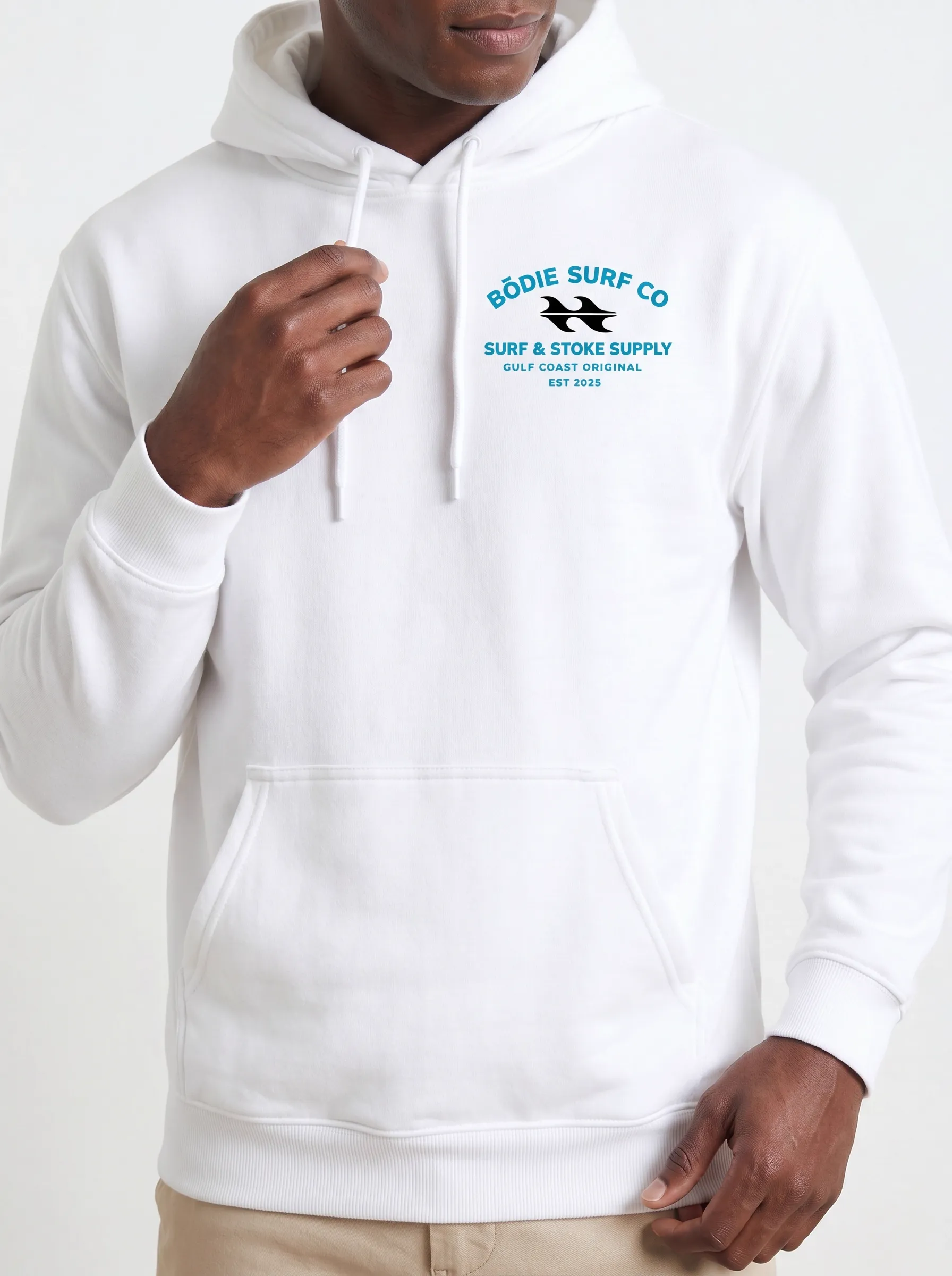 MODA AI output 5 — Black male model in white Bödie Surf Co hoodie, chest logo legible, demonstrating logo reproduction and skin tone realism