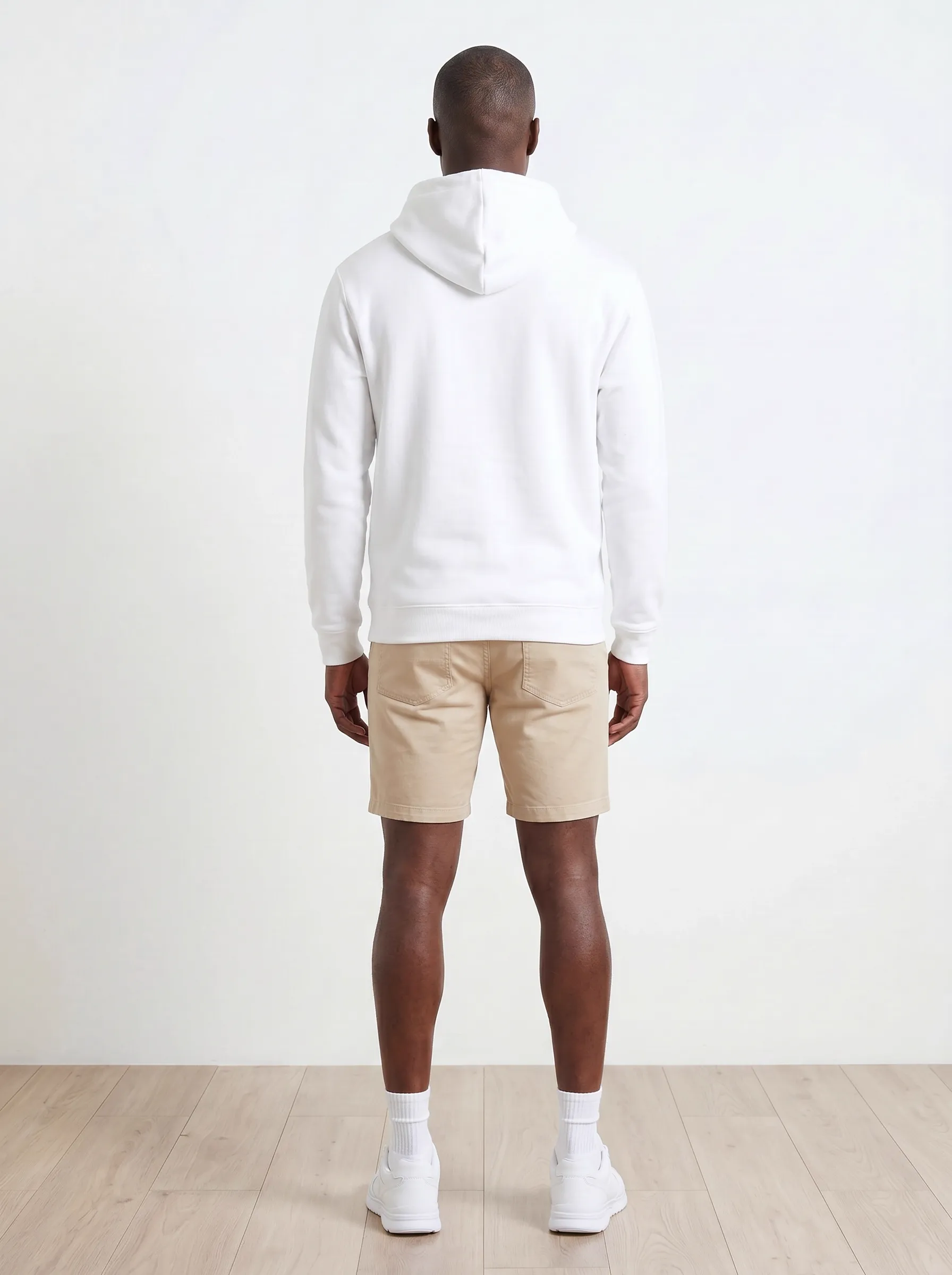 MODA AI output 8 — Black male model in white Bödie Surf Co hoodie, chest logo legible, demonstrating logo reproduction and skin tone realism