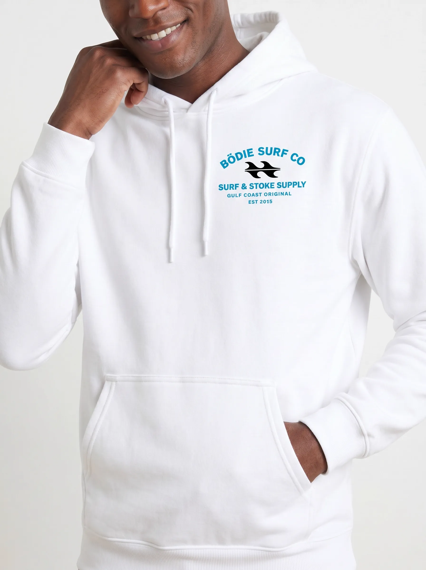 MODA AI output 9 — Black male model in white Bödie Surf Co hoodie, chest logo legible, demonstrating logo reproduction and skin tone realism