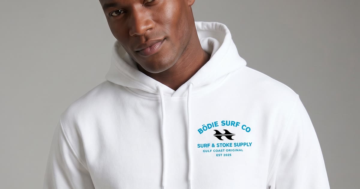 MODA AI logo reproduction — Black male model in white hoodie with chest logo showing every word legible, demonstrating AI fashion photography for branded apparel on Shopify