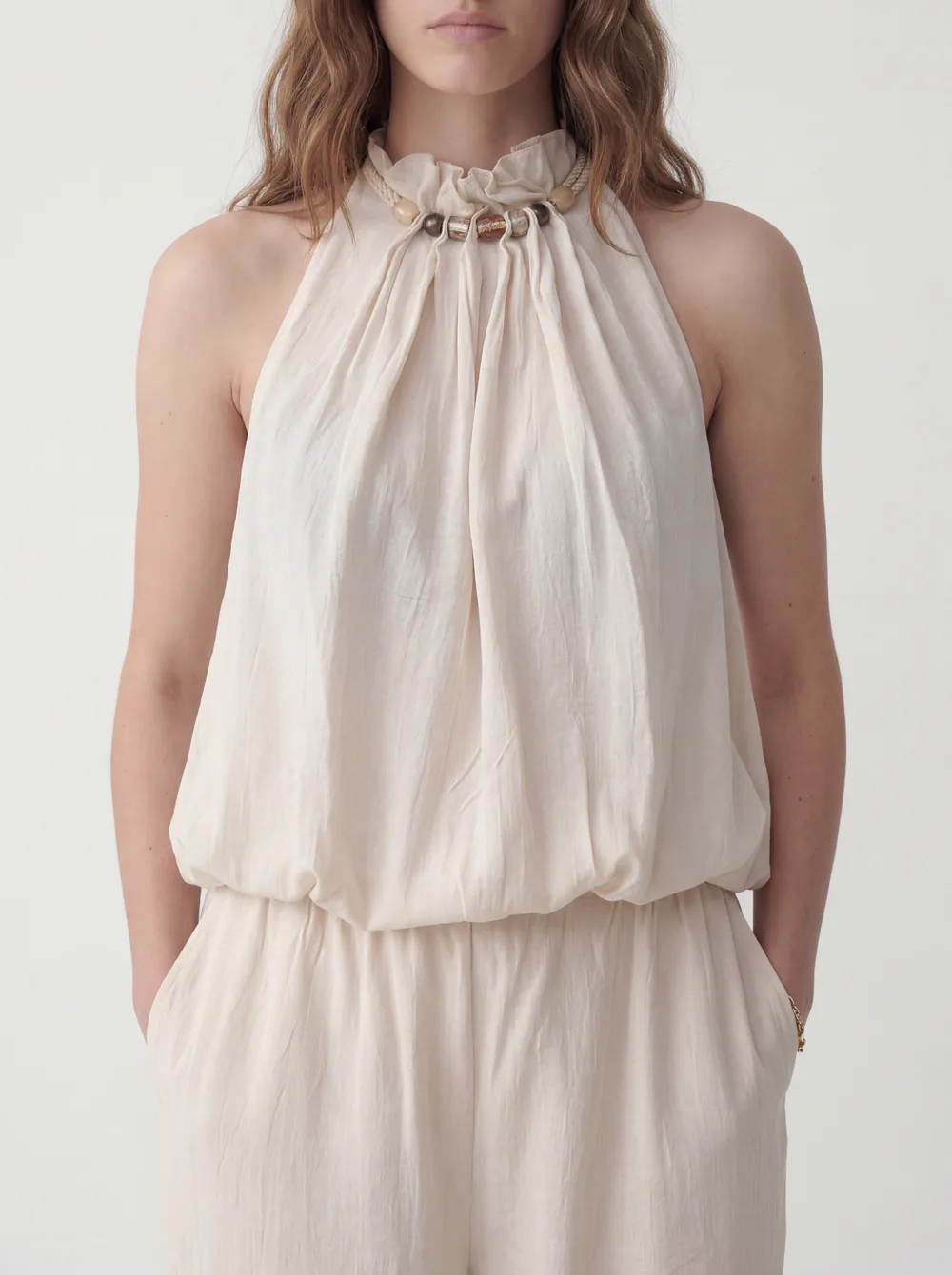 MODA catalog shot 6 of 10 — the generated model in the cream halter jumpsuit, consistent across every angle